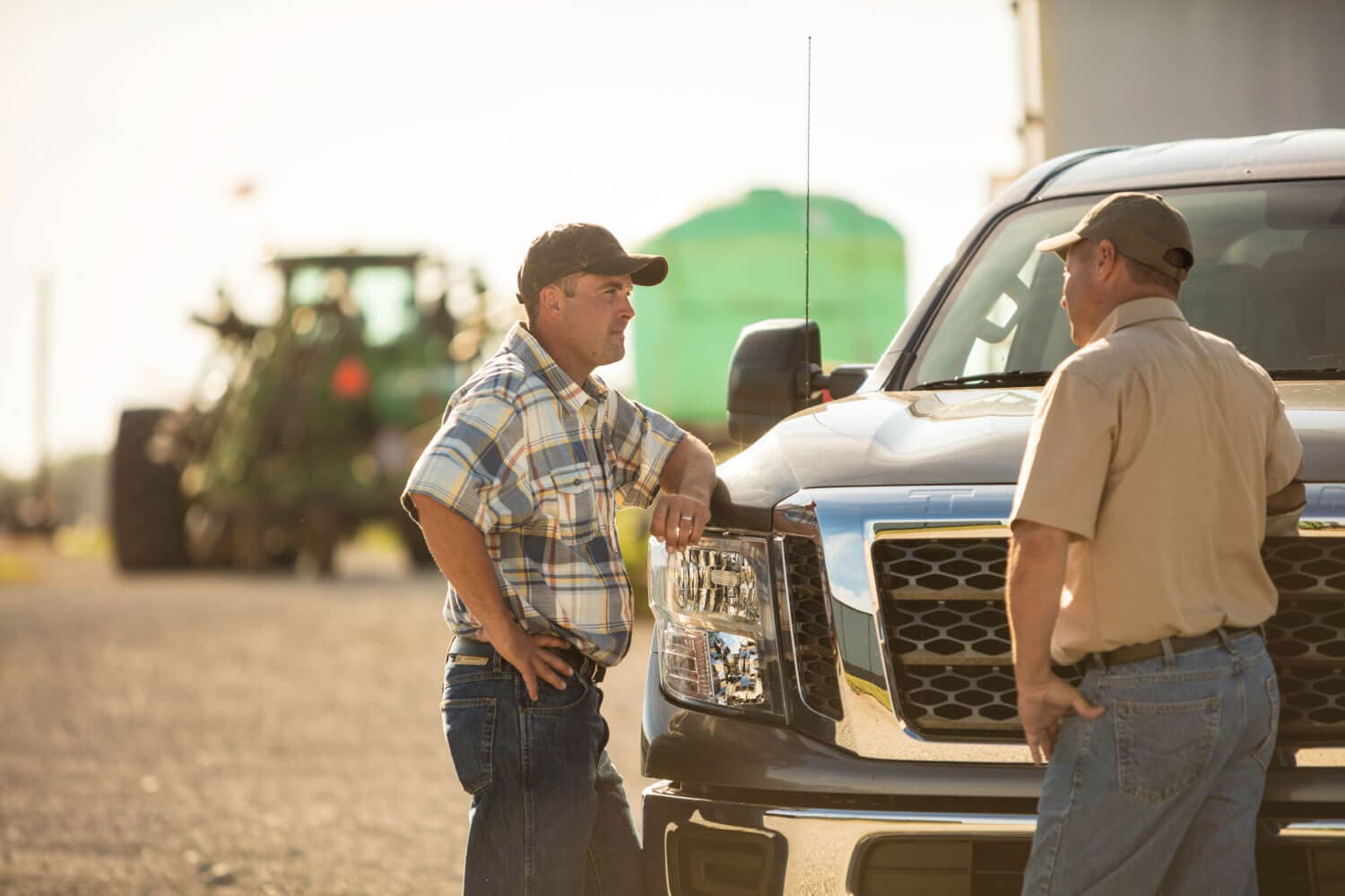 Guys talking by a truck