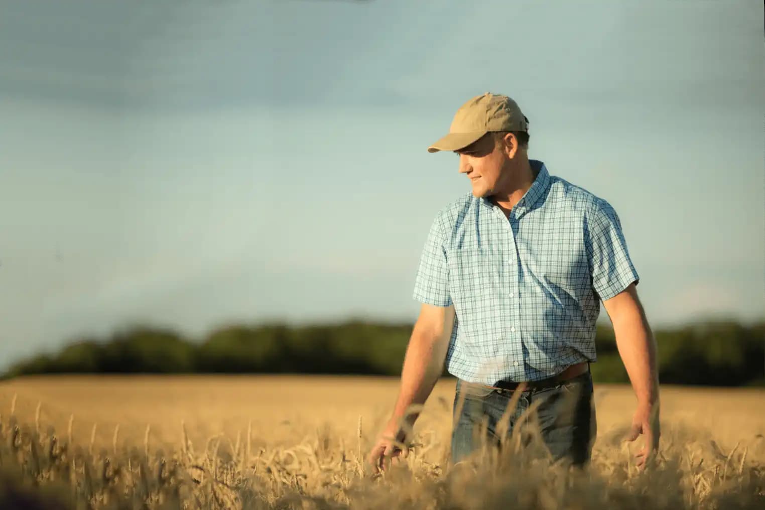 man walking in field